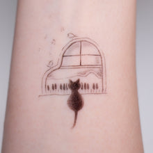 Load image into Gallery viewer, Black Cat Napping on A Piano Safe, waterproof, and fashionable. Cute Matching Tattoo ideas, Black Cat Lucky Cat Body Art, Blessing Tattoo Ideas, Fun Animal Fashion Accessories, Pet Toy, Doodle Cat Tattoos, Piano Tattoos, Fairy Tale Accessories.