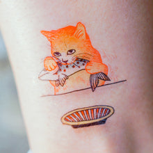 Load image into Gallery viewer, Cat Loves Fish Tattoo - LAZY DUO TATTOO Life of Cat Feeding Tattoo Ideas Golden Kitten Tattoo Meow Naughty Cat Neko Tattoos HK Temporary Tattoo Sticker Water Color Tattoo LAZY DUO Tattoo Shop Hong Kong HK 愛玩百厭貓紋身黃貓浪浪喵寵物刺青 浪浪香港紋身貼紙刺青紋身師設計印刷訂做客製 Custom Temporary Tattoo Event Printing Tattooist artist HK tattoo shop MANE INK Tattooer Tattoo Artist Taiwan fine line ornament tattoo 台灣製 刺青師紋身師