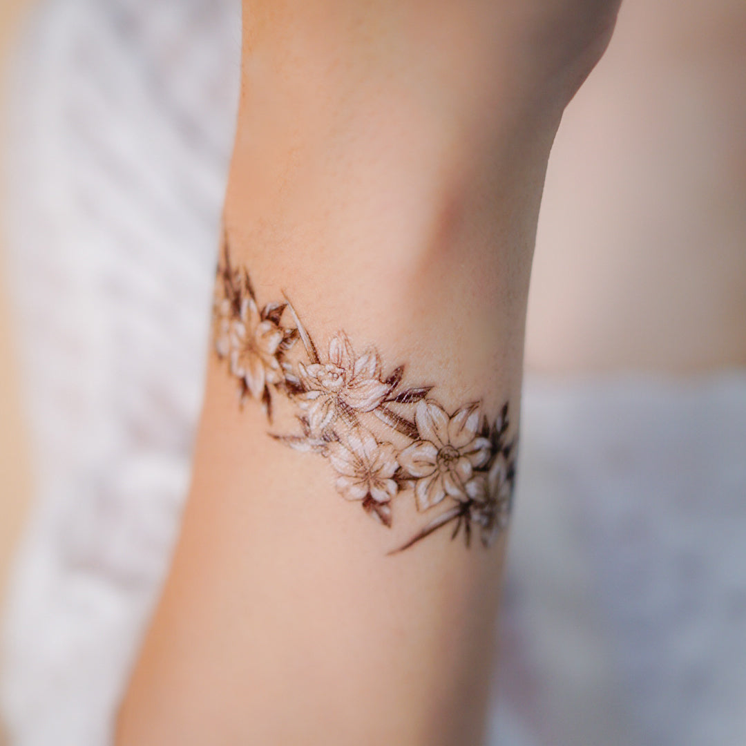 Uncommon Girly Wrap Wrist Tattoo Ideas