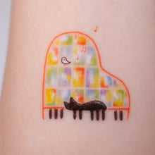 Load image into Gallery viewer, Black Cat Napping on A Piano Safe, waterproof, and fashionable. Cute Matching Tattoo ideas, Black Cat Lucky Cat Body Art, Blessing Tattoo Ideas, Fun Animal Fashion Accessories, Pet Toy, Doodle Cat Tattoos, Piano Tattoos, Fairy Tale Accessories.
