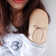Load image into Gallery viewer, Minimal Ribbon Bow Tattoo - LAZY DUO TATTOO
