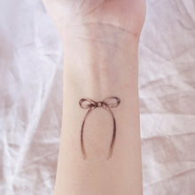 Load image into Gallery viewer, Minimal Ribbon Bow Tattoo - LAZY DUO TATTOO
